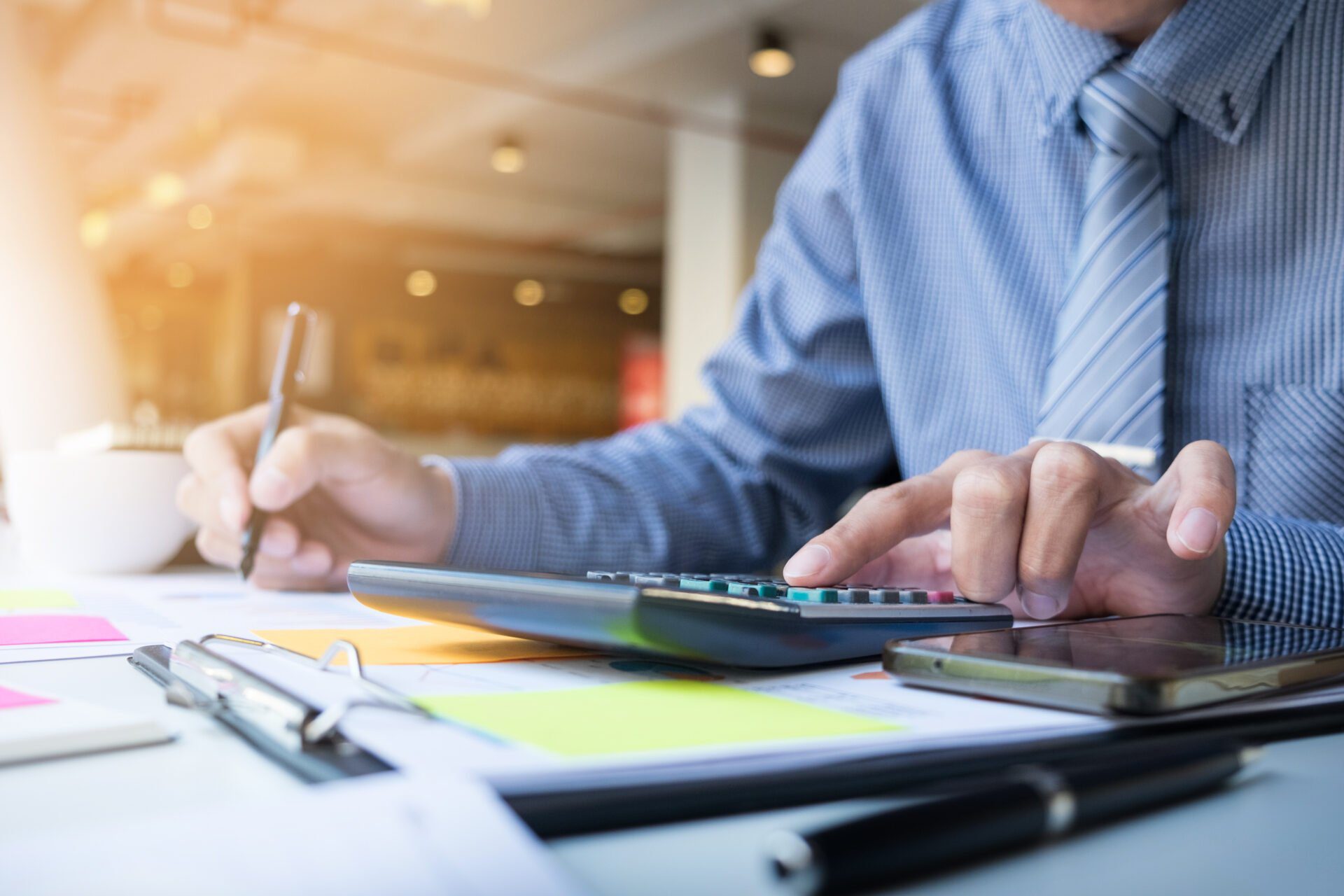 business finance man calculating budget numbers, invoices and fi